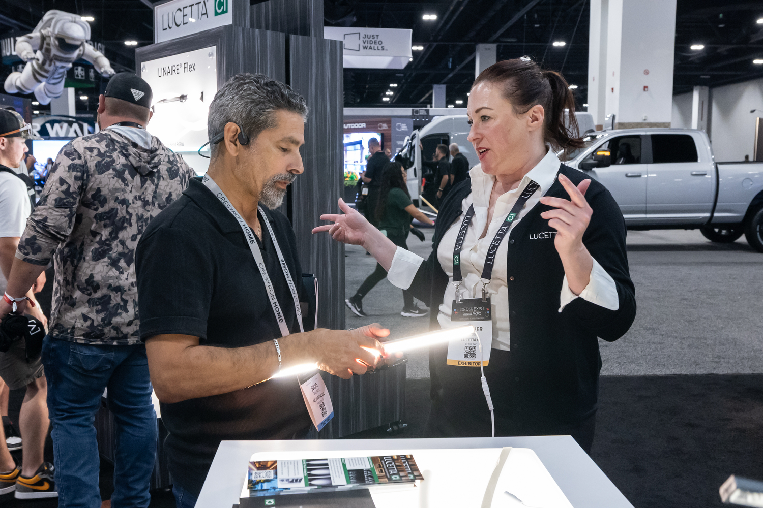 Attendee at CEDIA Expo/CIX viewing a new lighting product from Lucetta CI.