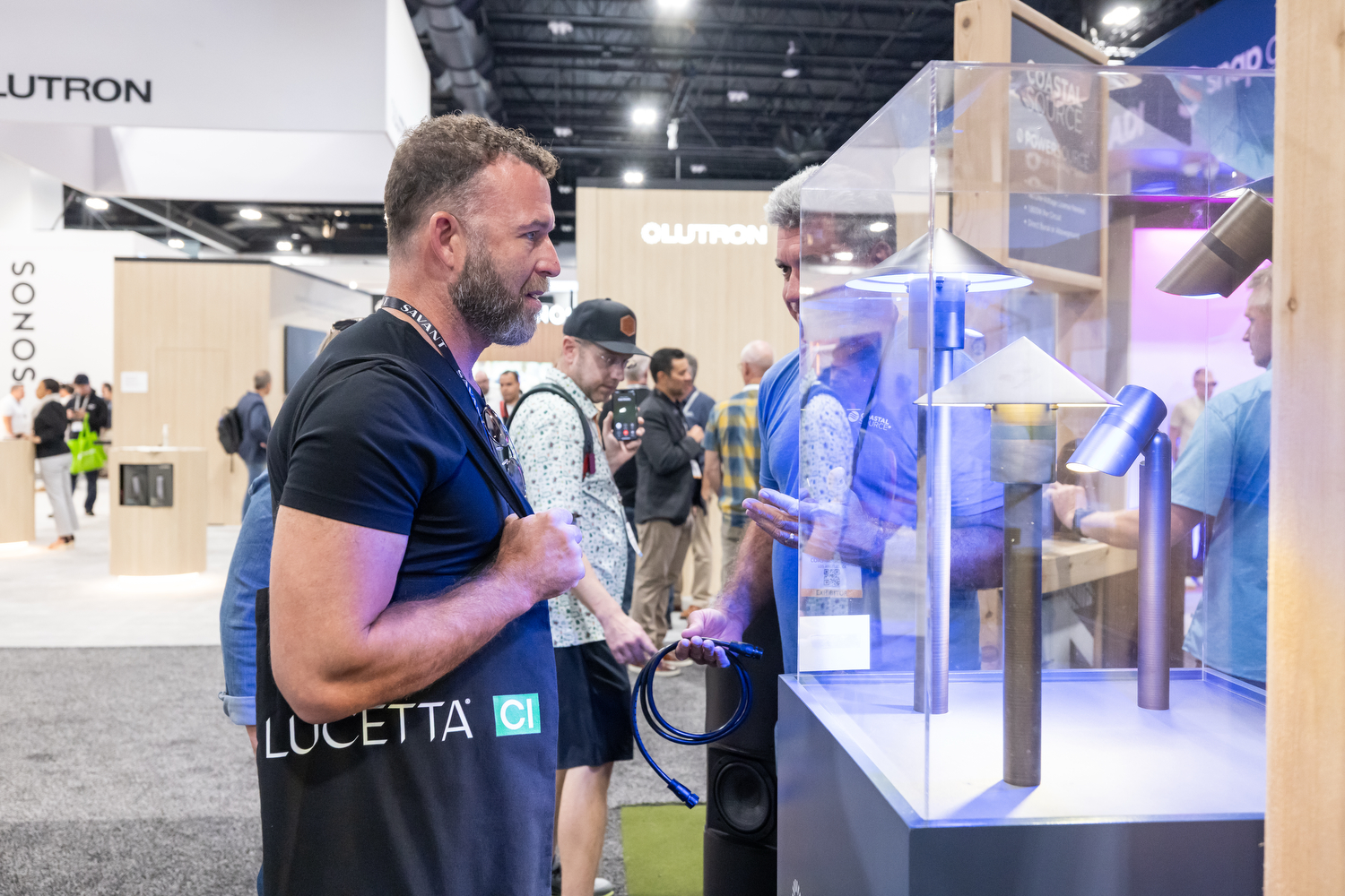 Attendee viewing lighting solutions at CEDIA Expo/CIX.