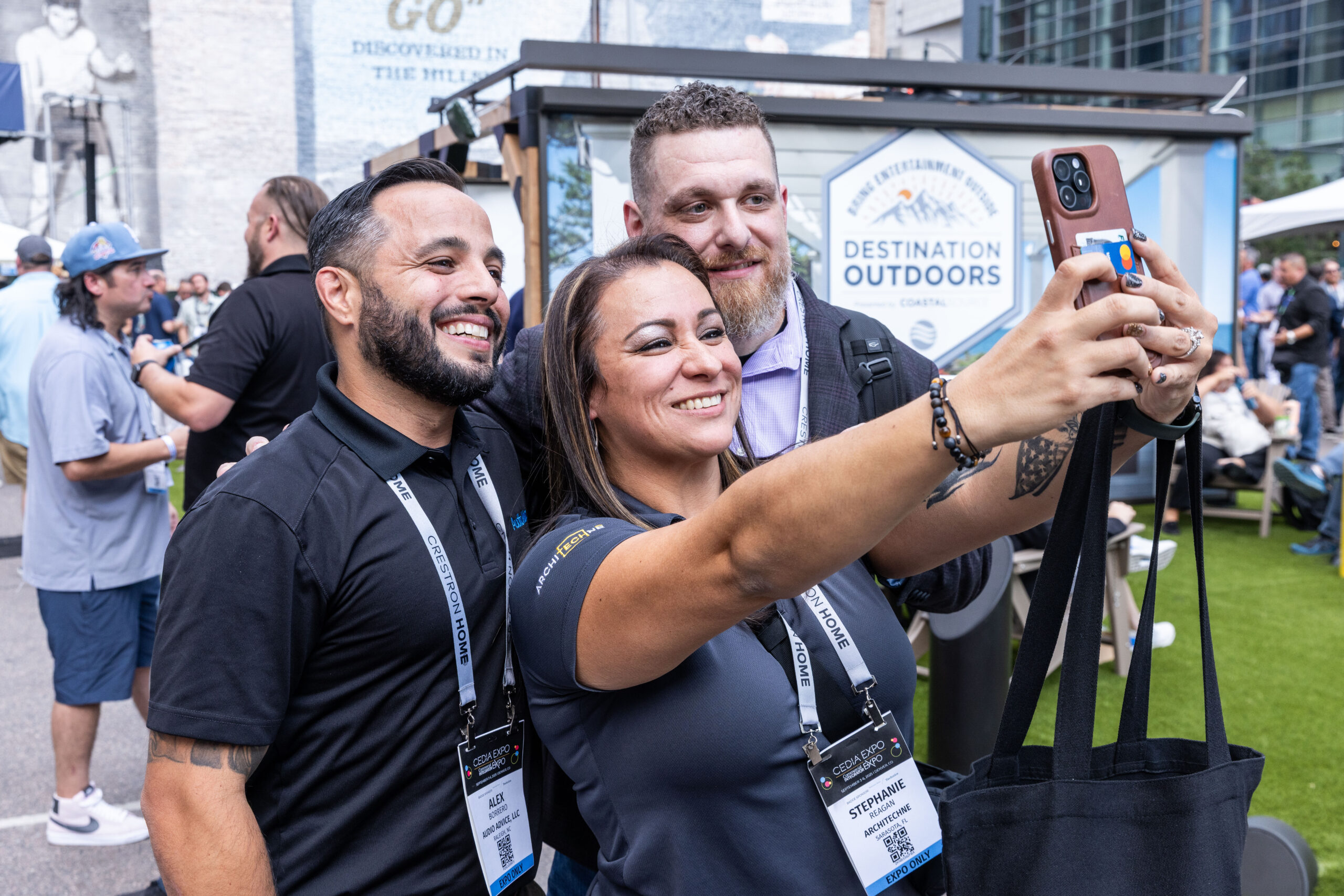 CEDIA Expo/CIX attendees enjoying a show feature and taking a group photo