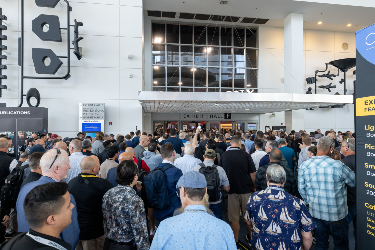 Large crowd of attendees entering the exhibit hall at CEDIA Expo/CIX