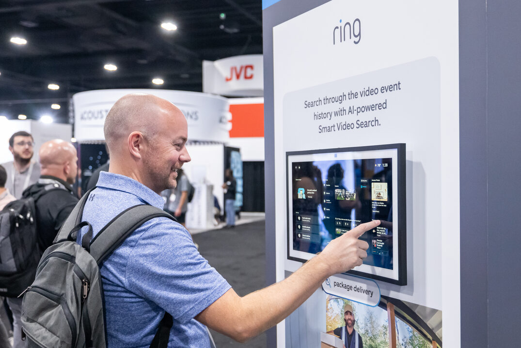 CEDIA Expo/CIX attendee experiencing a security product demo from Ring.