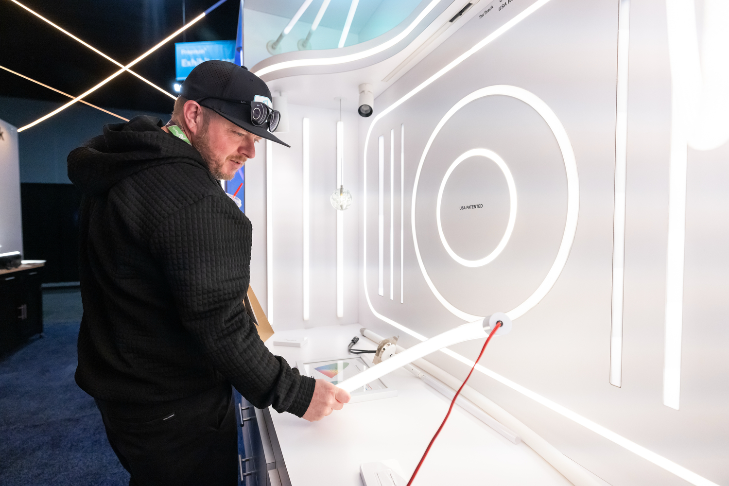 CEDIA Expo/CIX attendee viewing the newest lighting solutions at the show.